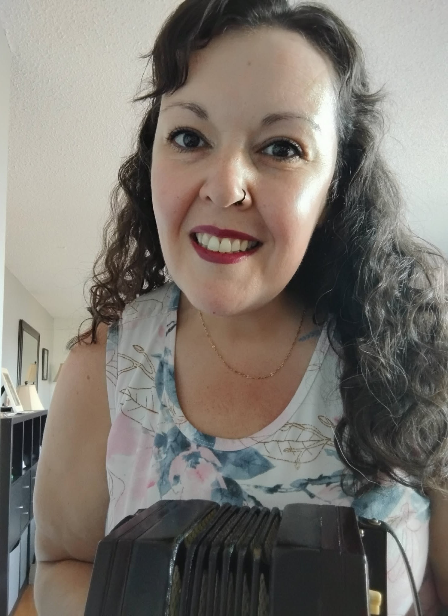 Christine, founder of CelticTradHub, with her Anglo concertina